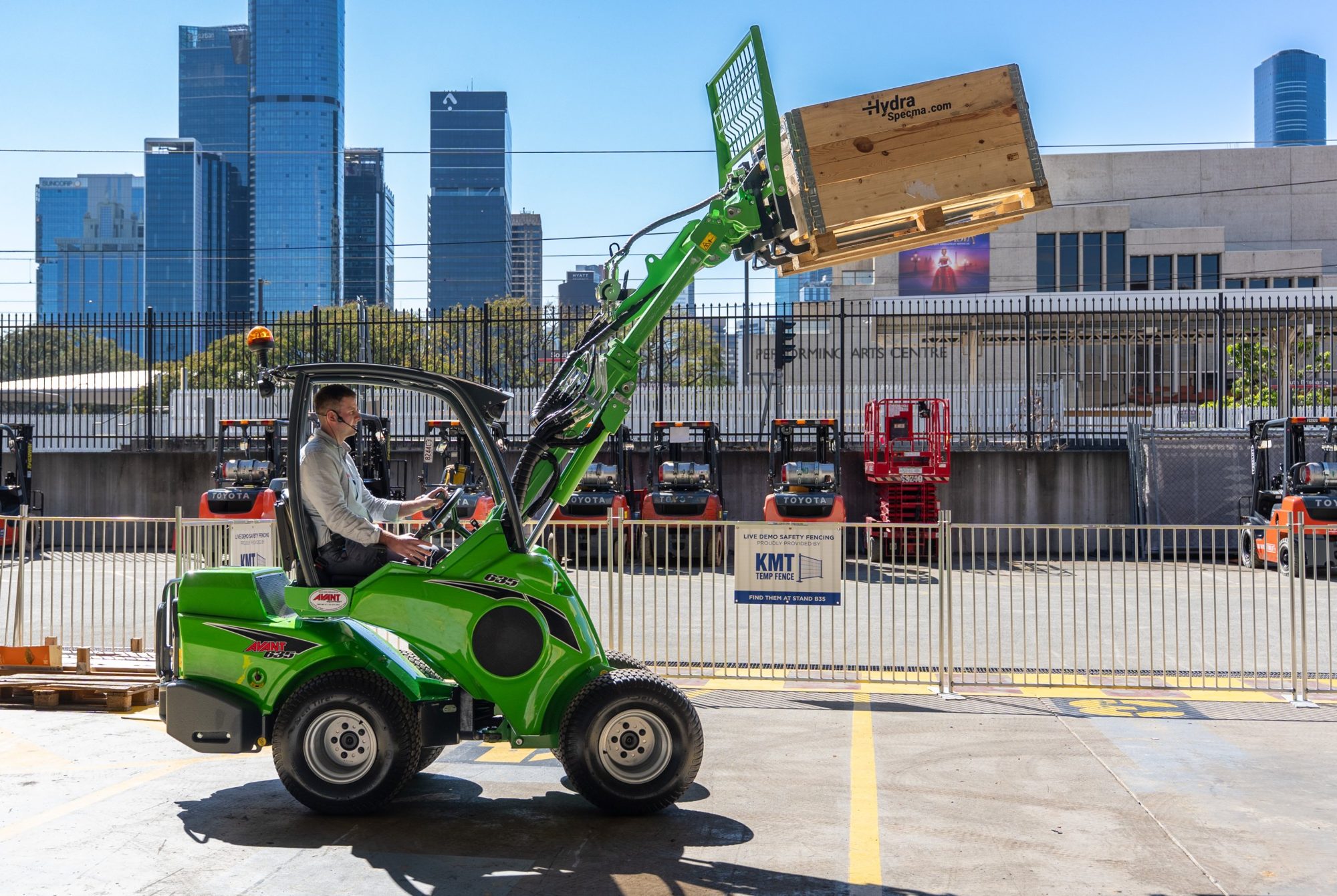 Avant loader lifting a pallet in the outdoor Live Demo area