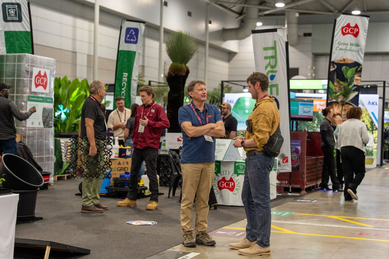 Exhibitors and visitors talking on the show floor