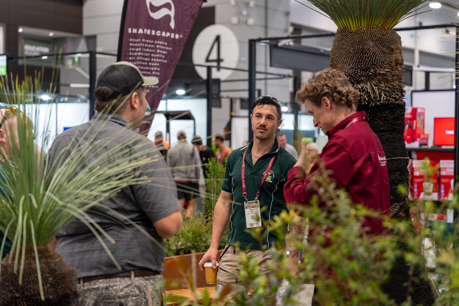 Visitors talking among native plantings