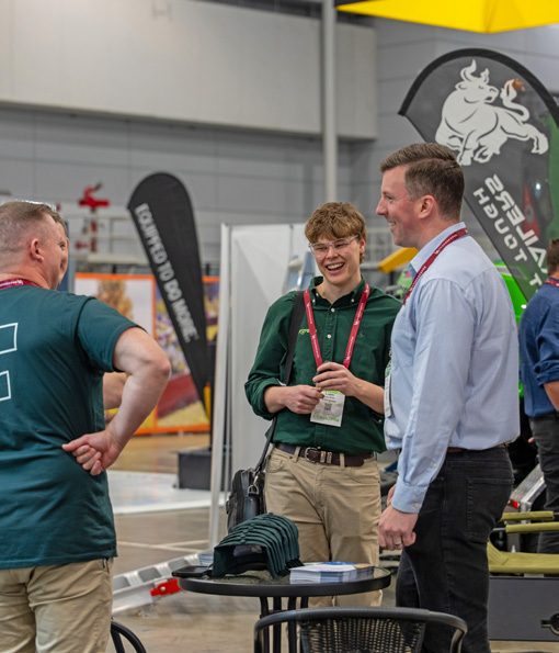 Exhibitor in conversation with visitors