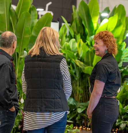 Visitors at a lush nursery display